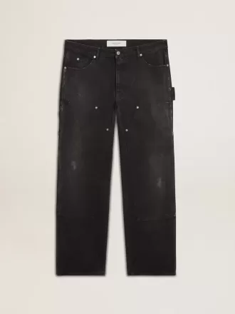 Zwarte katoenen herenjeans met versleten effect en patches aan de voorkant
