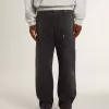 Zwarte katoenen herenjeans met versleten effect en patches aan de voorkant