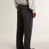 Zwarte katoenen herenjeans met versleten effect en patches aan de voorkant