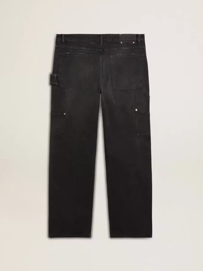 Zwarte katoenen herenjeans met versleten effect en patches aan de voorkant