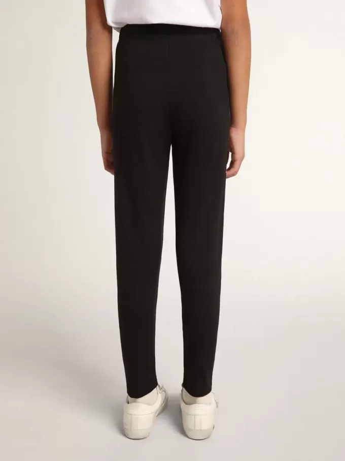 Zwarte legging voor meisjes met witte sterren aan de zijkanten