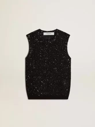 Zwarte mesh-top met pailletten en contrasterende details