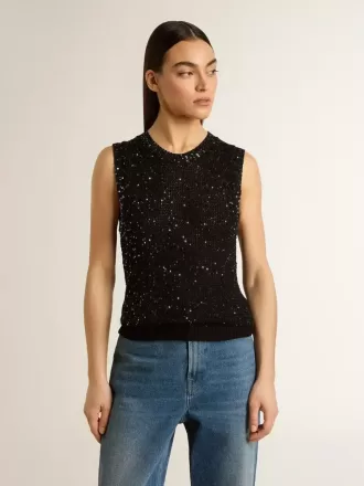 Zwarte mesh-top met pailletten en contrasterende details