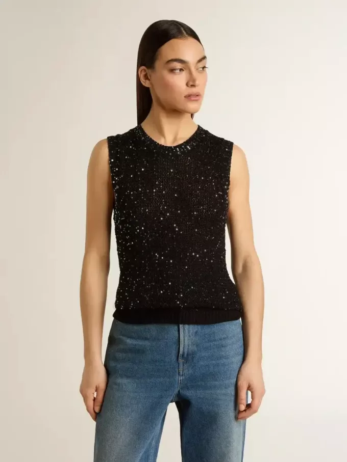 Zwarte mesh-top met pailletten en contrasterende details