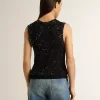 Zwarte mesh-top met pailletten en contrasterende details