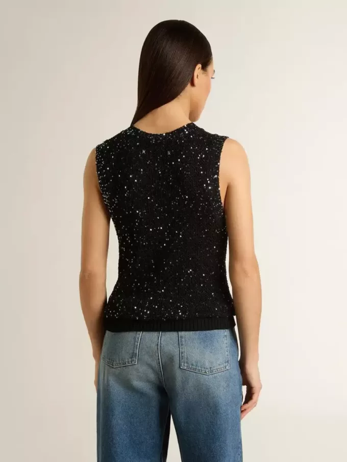 Zwarte mesh-top met pailletten en contrasterende details