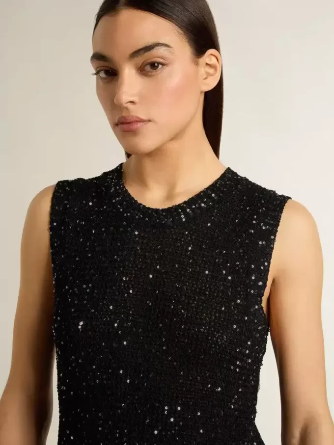 Zwarte mesh-top met pailletten en contrasterende details