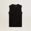 Zwarte mesh-top met pailletten en contrasterende details